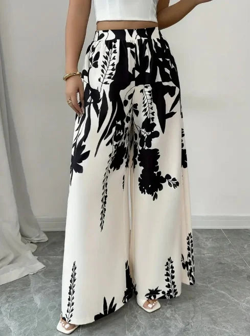 Pantalones anchos de satén sedoso con estampado floral de...