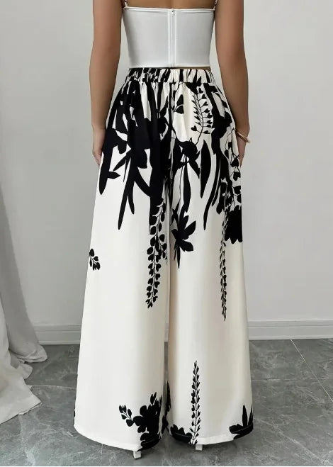Pantalones anchos de satén sedoso con estampado floral de...